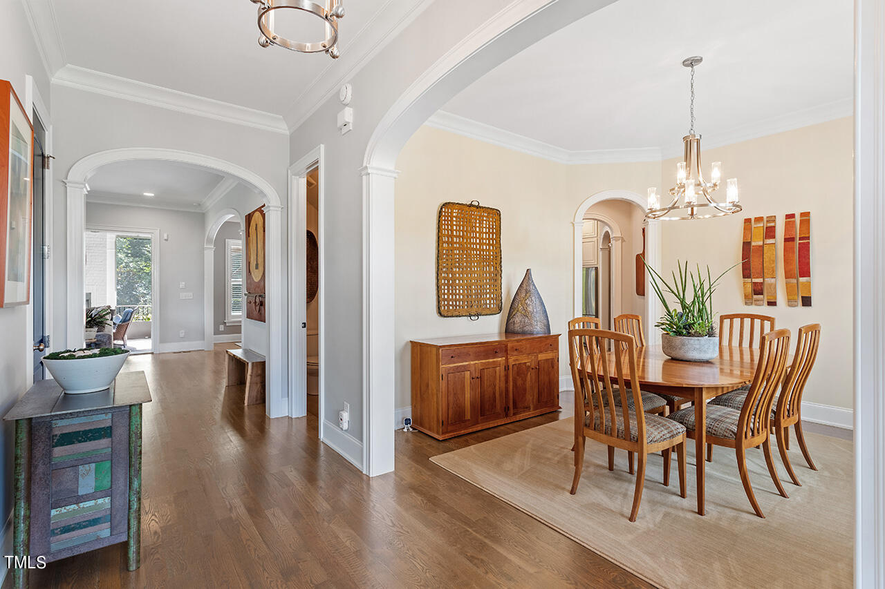 6940 Bartons Bend Way Raleigh, NC 27614 - Photo 8 of 66 a view of a dining room with furniture window and wooden floor