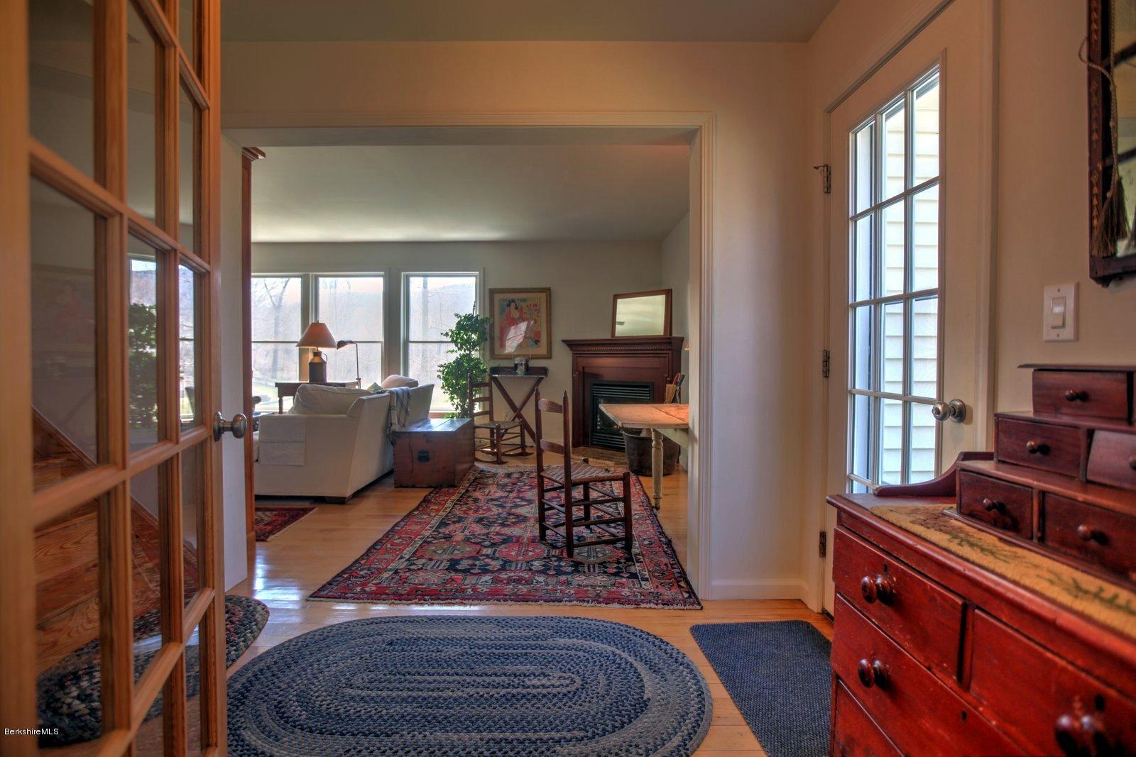 20 Main Road Tyringham, MA 01238 - Photo 15 of 50 a living room with furniture windows and a fireplace