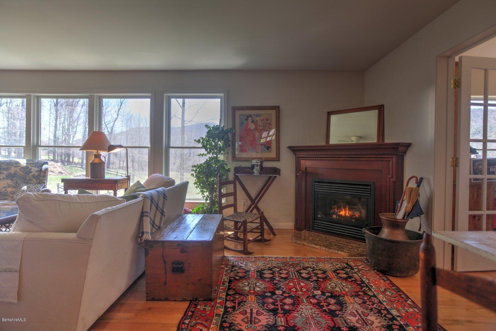 20 Main Road Tyringham, MA 01238 - Photo 17 of 50 a living room with furniture and a fireplace