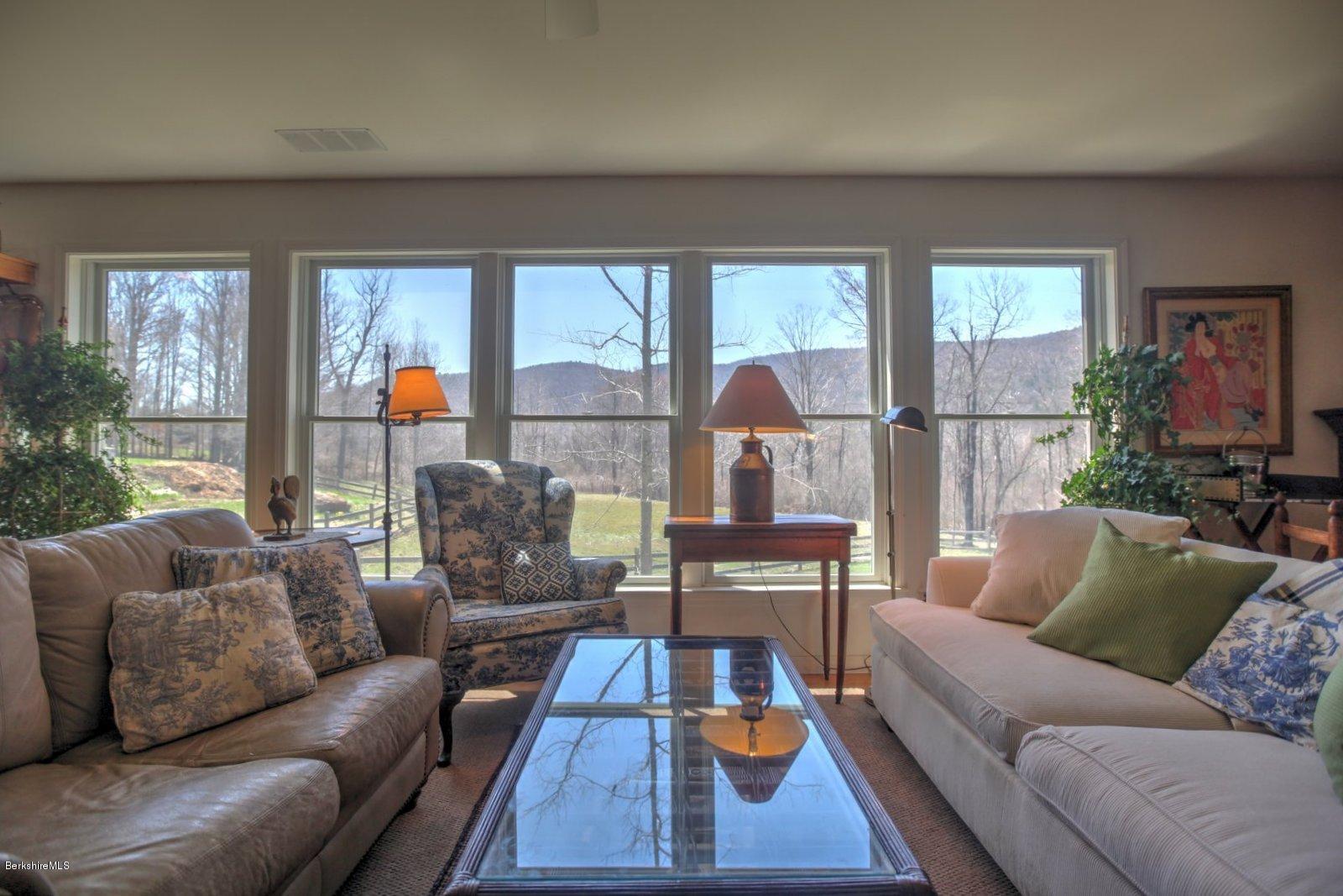 20 Main Road Tyringham, MA 01238 - Photo 18 of 50 a living room with furniture and a table