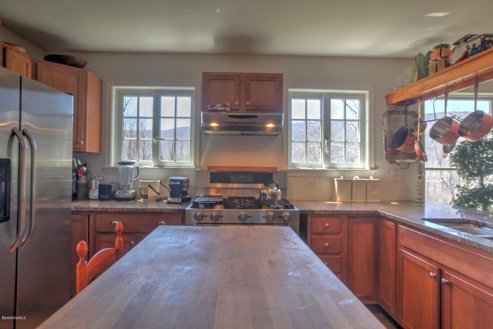 20 Main Road Tyringham, MA 01238 - Photo 24 of 50 a kitchen with stainless steel appliances a sink stove and refrigerator