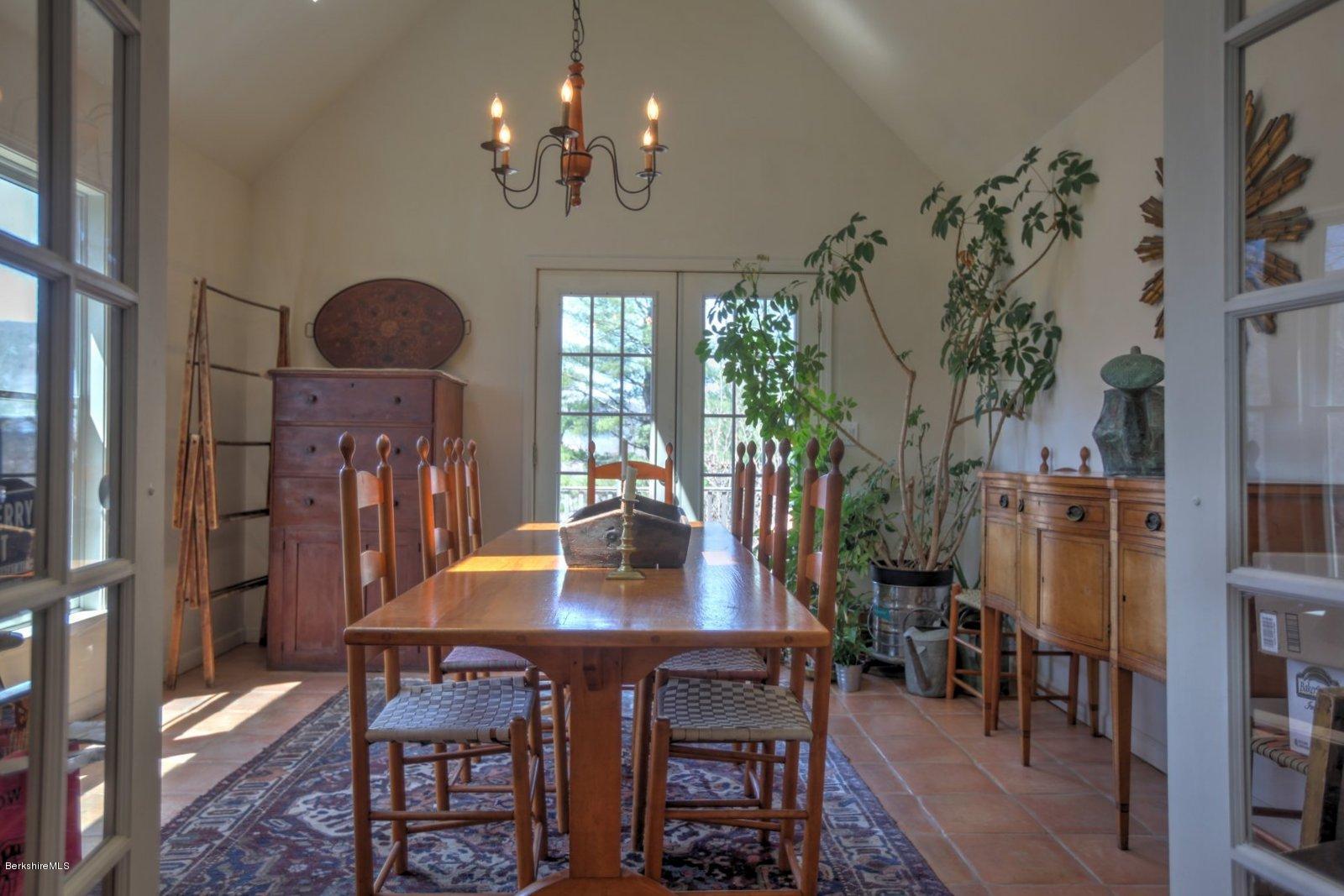 20 Main Road Tyringham, MA 01238 - Photo 25 of 50 a view of a dining room with furniture window and wooden floor