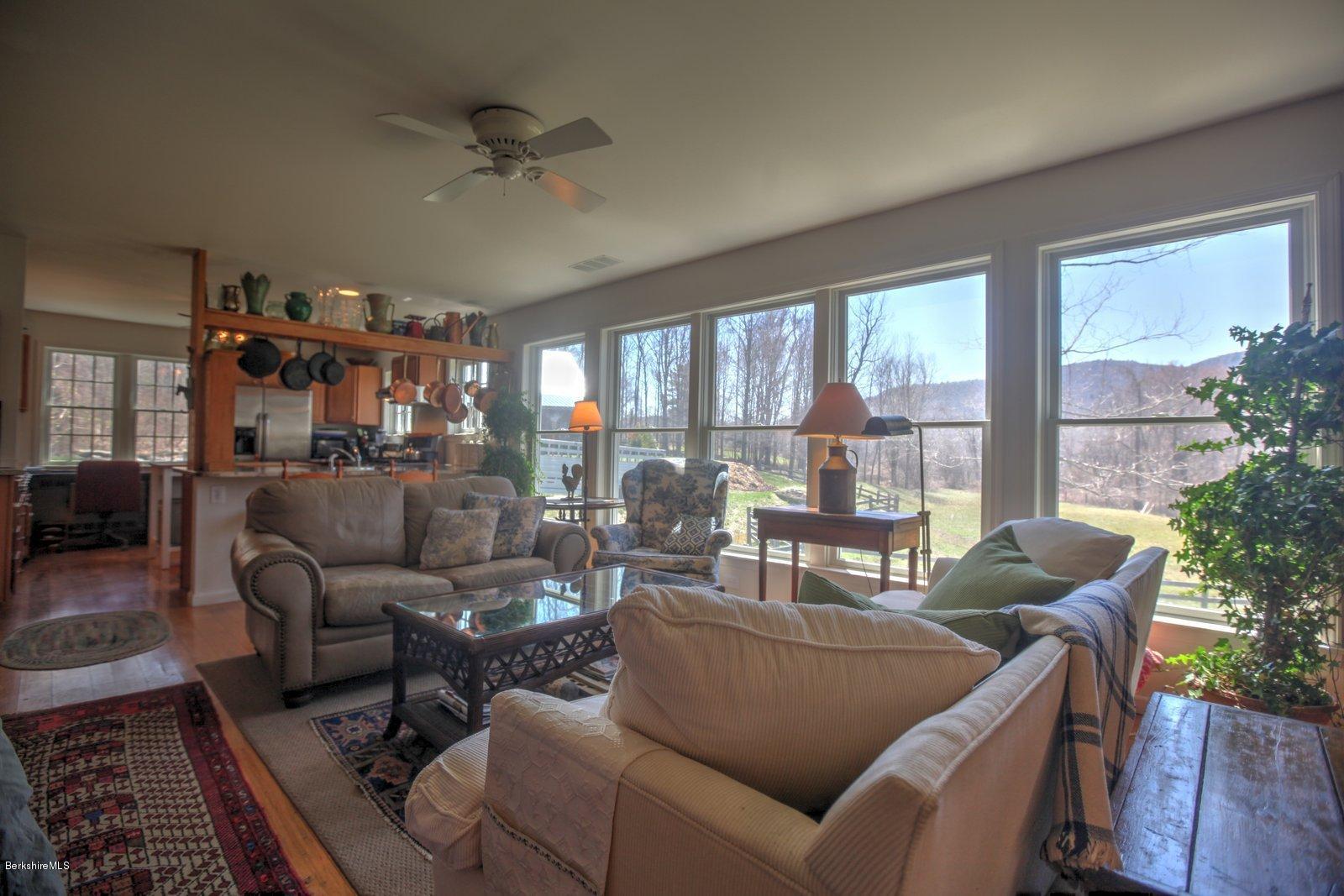 20 Main Road Tyringham, MA 01238 - Photo 27 of 50 a living room with furniture and a large window
