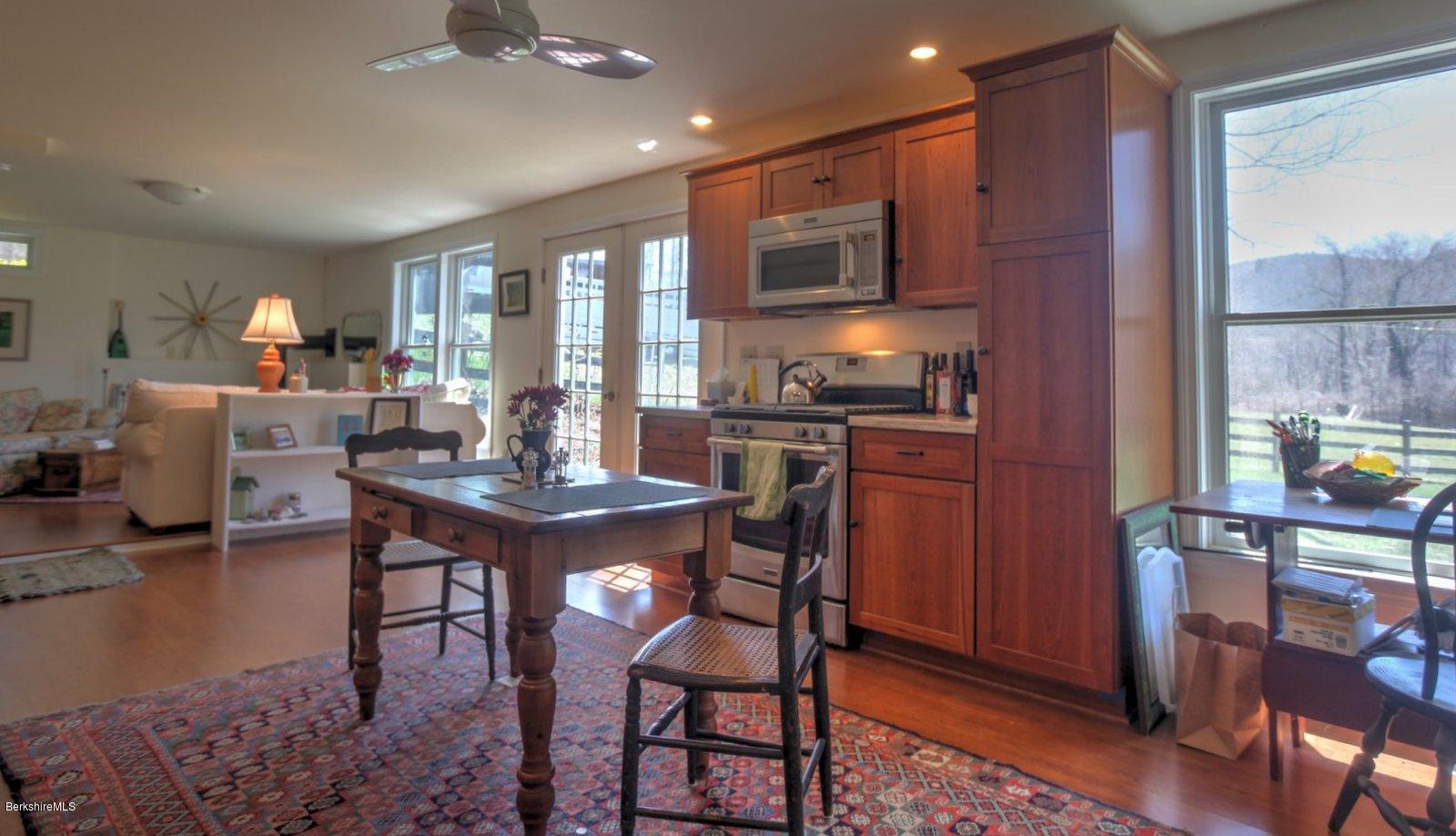 20 Main Road Tyringham, MA 01238 - Photo 35 of 50 a view of a dining room with furniture window and wooden floor