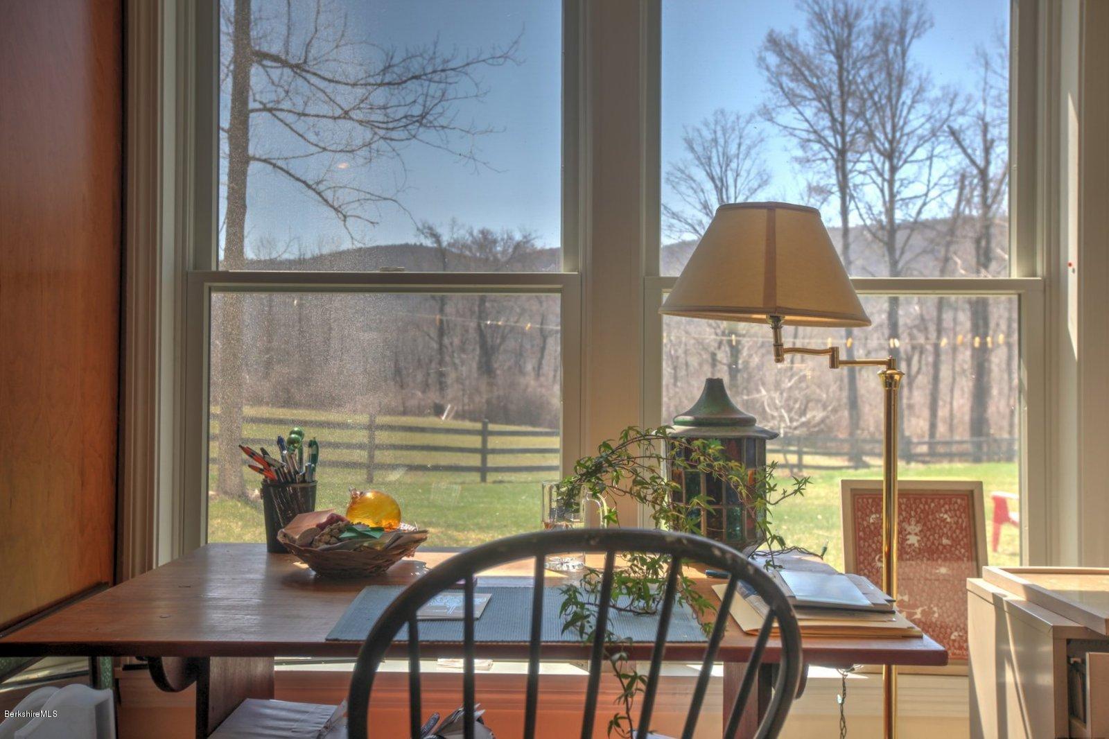 20 Main Road Tyringham, MA 01238 - Photo 36 of 50 a view of a balcony dining table and chairs