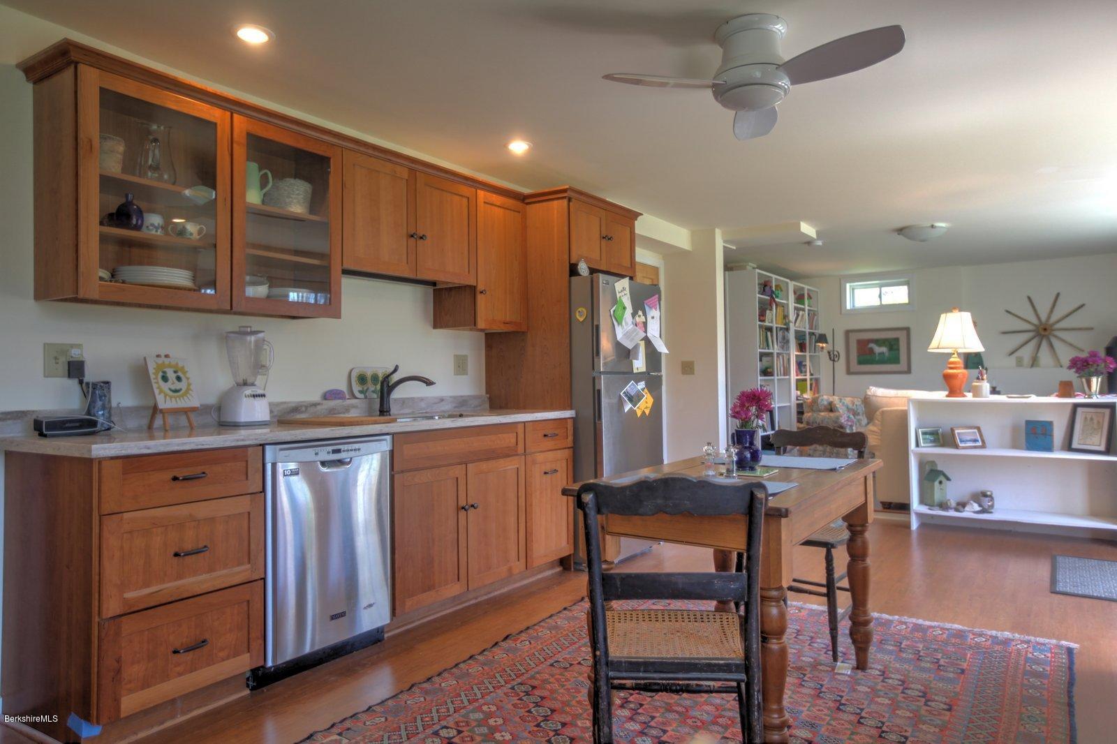 20 Main Road Tyringham, MA 01238 - Photo 38 of 50 a kitchen that has a lot of cabinets in it and appliances