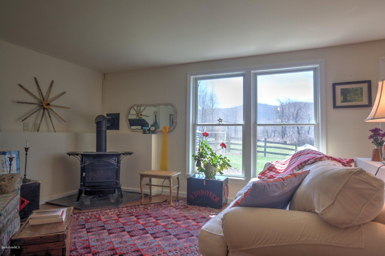 20 Main Road Tyringham, MA 01238 - Photo 40 of 50 a living room with furniture and a window