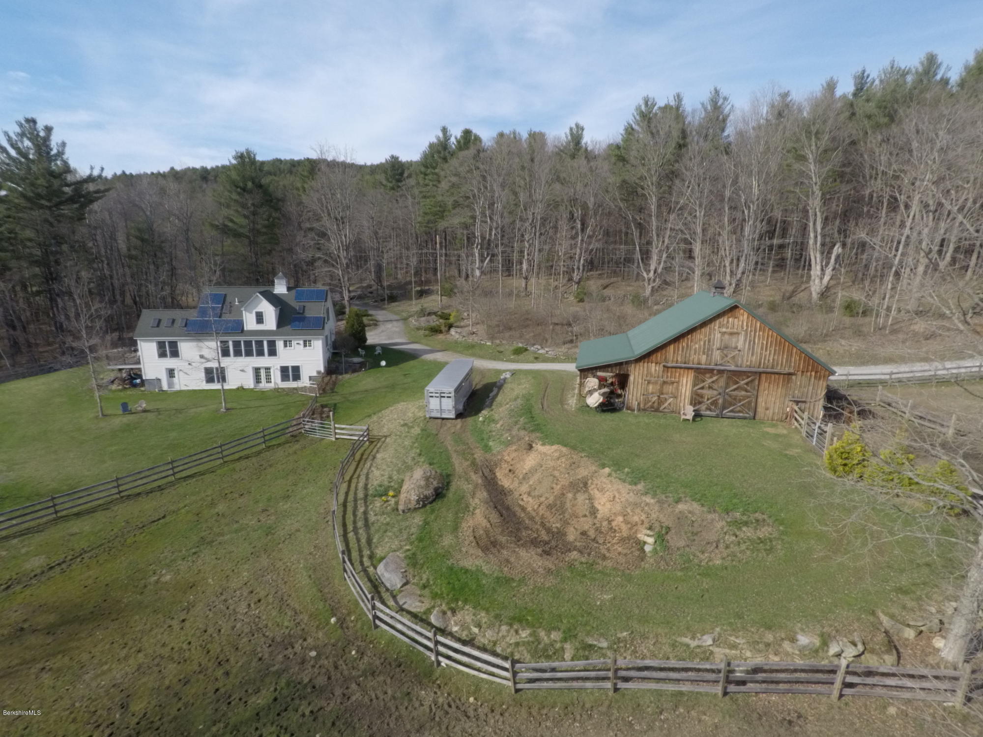 20 Main Road Tyringham, MA 01238 - Photo 5 of 50 a view of a house with a yard and sitting area