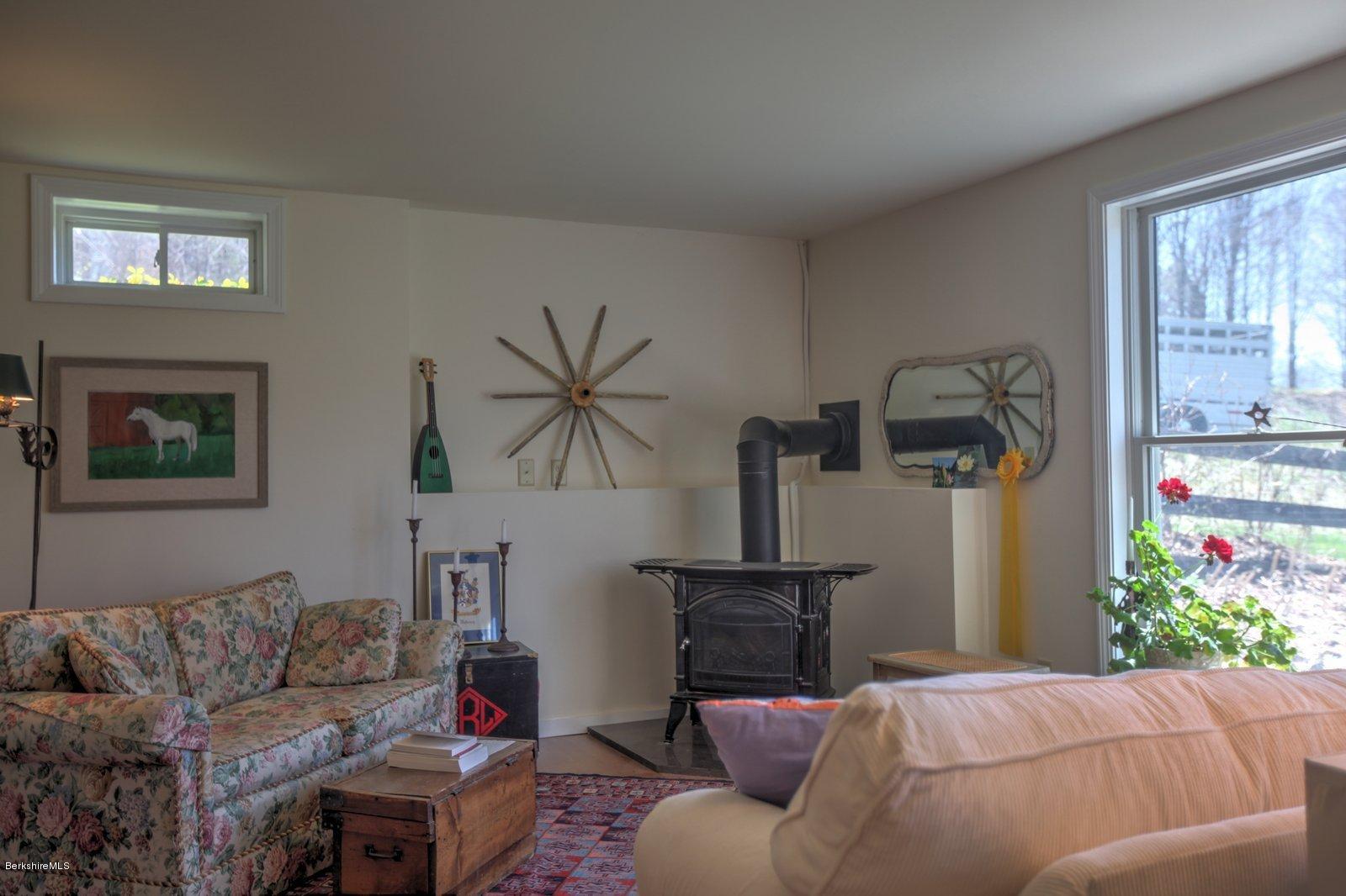 20 Main Road Tyringham, MA 01238 - Photo 42 of 50 a living room with furniture and a window