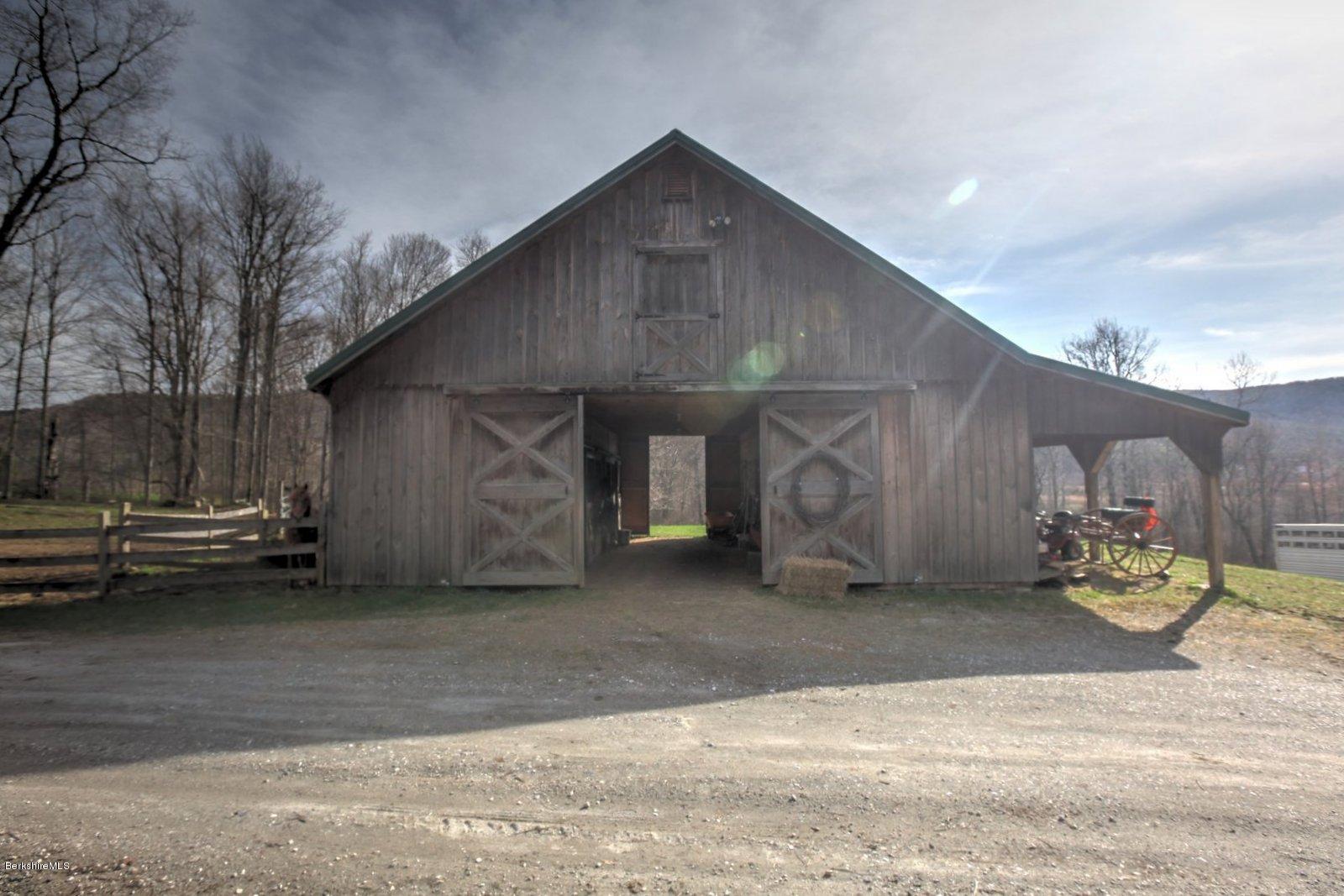 20 Main Road Tyringham, MA 01238 - Photo 46 of 50 a view of a house with a garage