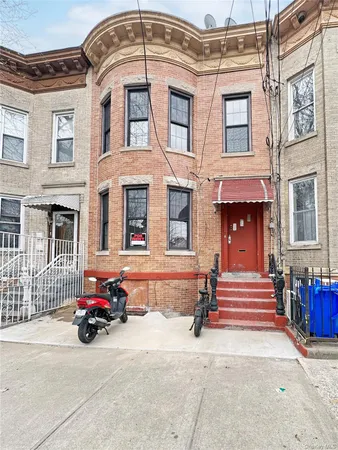 a view of a brick building with many windows