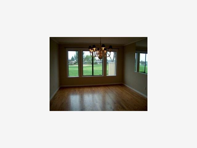 748 Duffin Drive Ridgemark, CA 95023 - Photo 4 of 8 a upper view of a living room and hall with wooden floor
