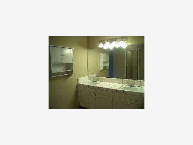 748 Duffin Drive Ridgemark, CA 95023 - Photo 8 of 8 a bathroom with a sink and mirror