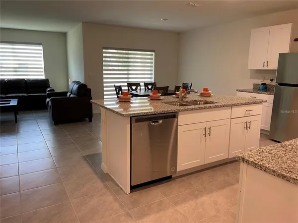 a kitchen with a sink and cabinets