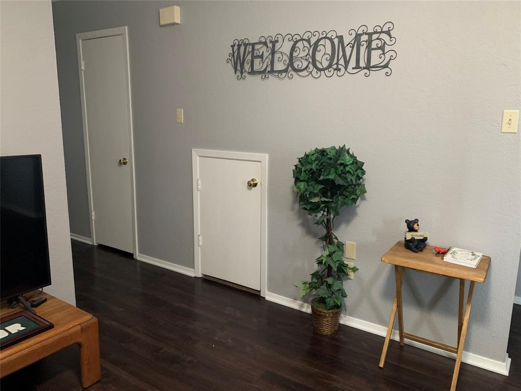 1226 Baylor Avenue, Unit 101 Waco, TX 76706 - Photo 3 of 8 a view of a workspace with furniture and wooden floor