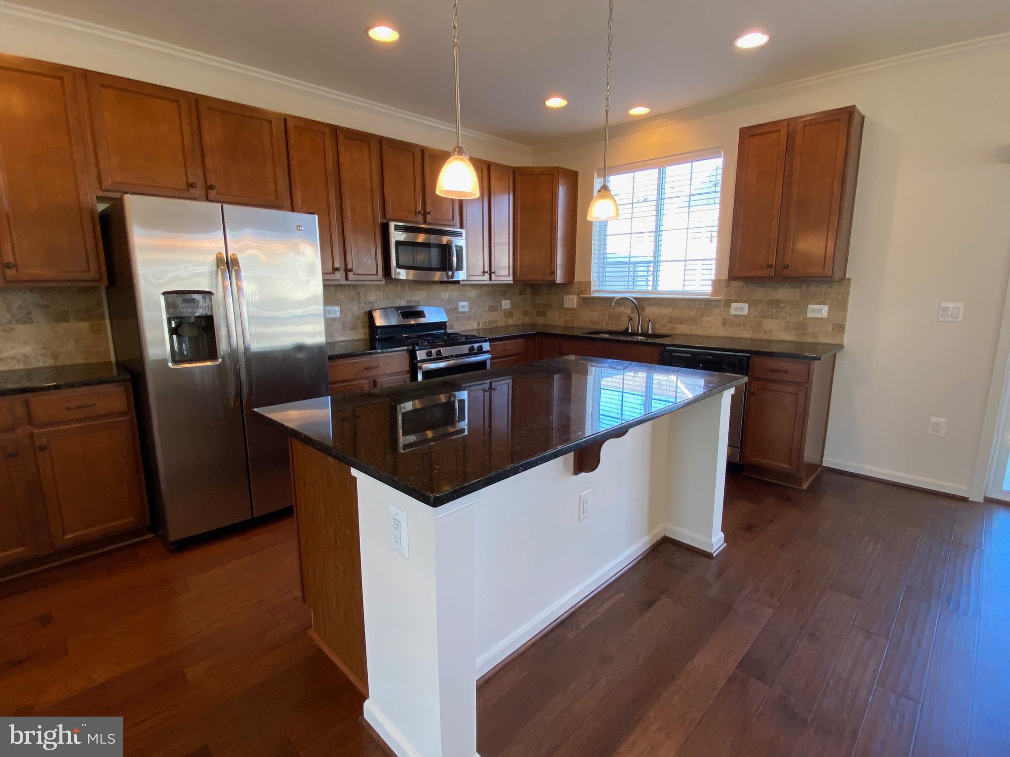 44153 Seawolve Square Chantilly, VA 20152 - Photo 11 of 52 Kitchen Cherry Wood cabinets.