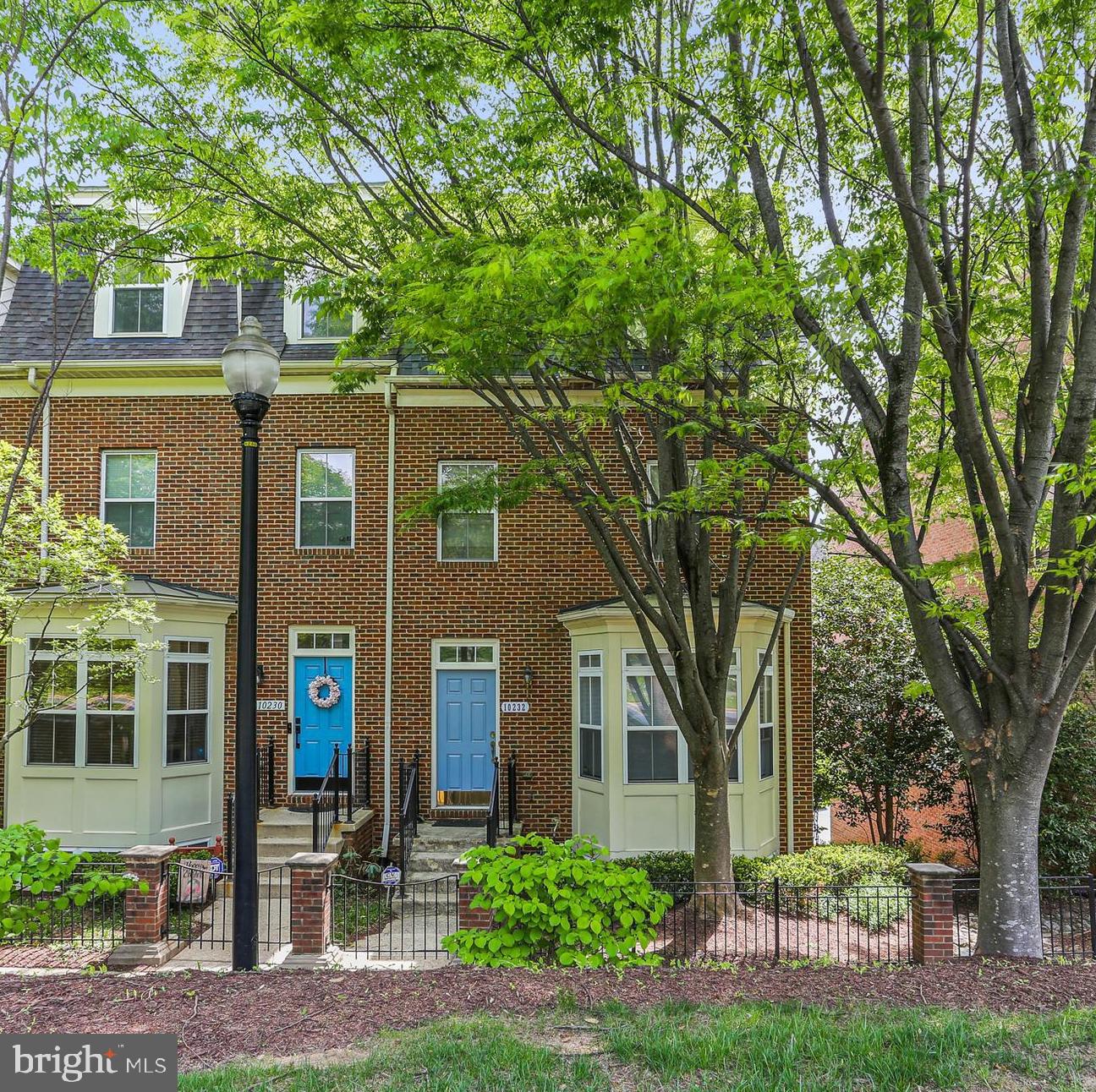 10232 Rutland Round Road, Unit 24 Columbia, MD 21044 - Photo 1 of 31 a front view of a house with garden