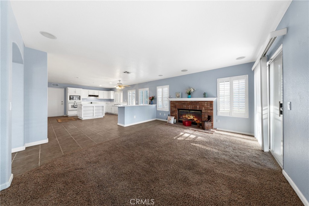 32858 Alderbrook Road Wildomar, CA 92595 - Photo 19 of 56 a living room with furniture and a fireplace