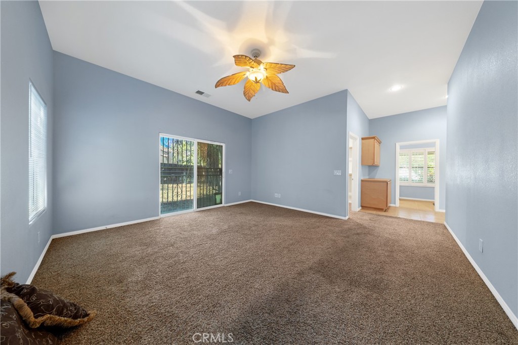 32858 Alderbrook Road Wildomar, CA 92595 - Photo 22 of 56 a view of a livingroom with a ceiling fan and window