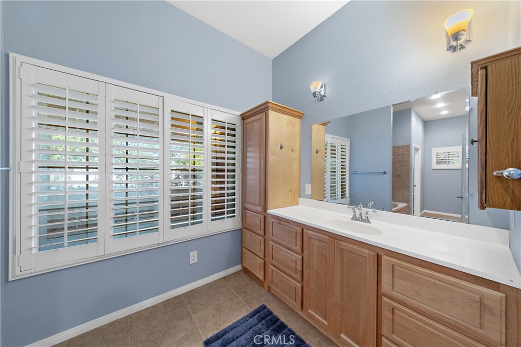 32858 Alderbrook Road Wildomar, CA 92595 - Photo 24 of 56 a bathroom with a sink double vanity and a shower