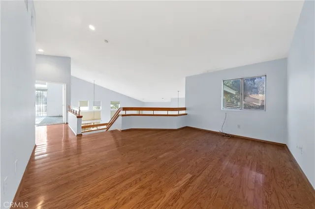 a bathroom with a tub sink mirror and a shower