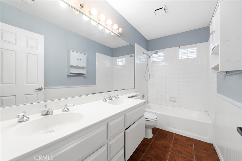 32858 Alderbrook Road Wildomar, CA 92595 - Photo 36 of 56 a bathroom with a tub sink mirror and a shower