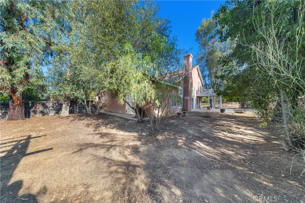 32858 Alderbrook Road Wildomar, CA 92595 - Photo 40 of 56 a view of a yard with plants and trees