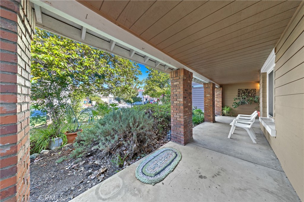 32858 Alderbrook Road Wildomar, CA 92595 - Photo 4 of 56 a view of a porch with furniture and floor to ceiling window