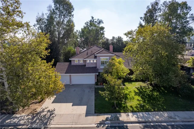 an aerial view of residential house with outdoor space