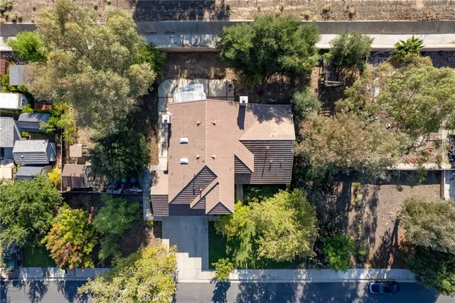 an aerial view of residential house and outdoor space