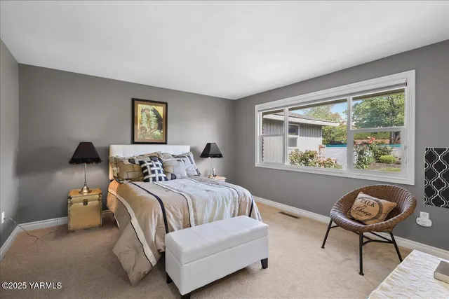 a bathroom with a sink a bathtub and a window