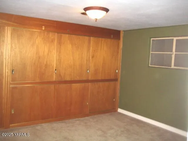 a view of a room with wooden walls