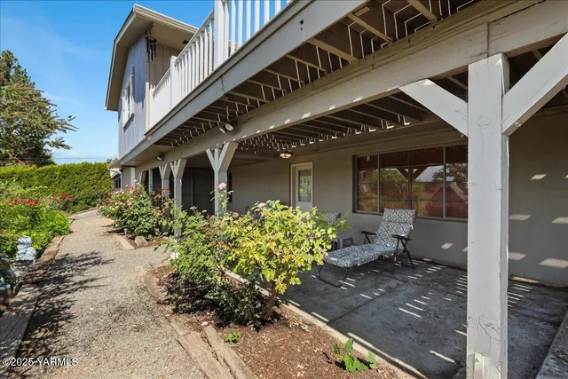 a view of a pathway gate with a wooden fence