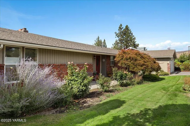 a backyard of a house with lots of green space