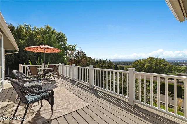 a view of balcony with furniture and wooden deck