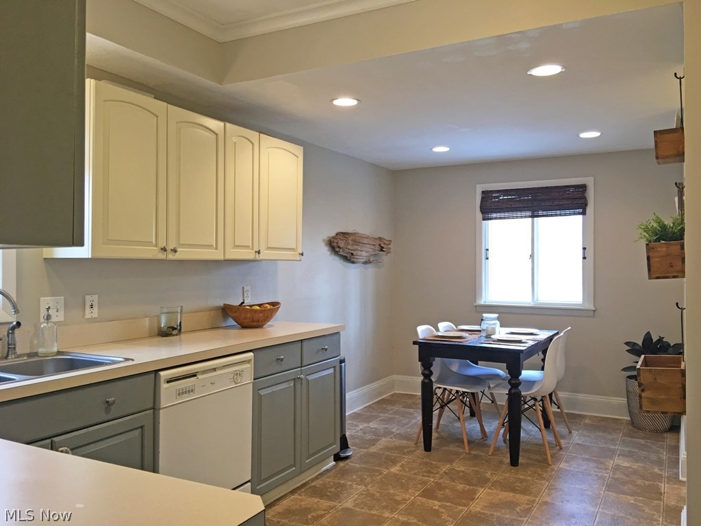 3427 Clarendon Road Cleveland, OH 44118 - Photo 4 of 21 Spacious kitchen with nice counter top space and easy to reach cupboards. Kitchen is decorated in pleasing colors. Plus, recessed lights, & large eating area too.