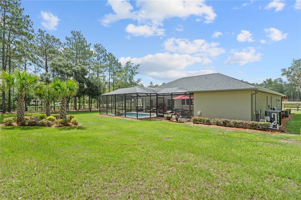 12929 Southwest 89th Street Dunnellon, FL 34432 - Photo 55 of 76 a view of a house with a big yard and sitting area