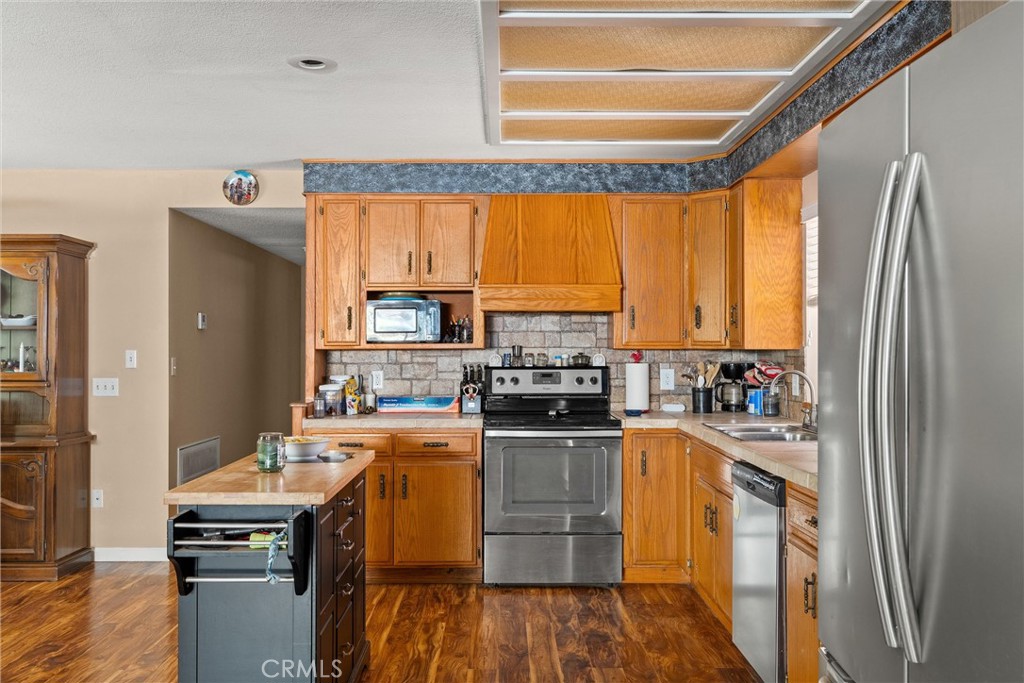 6176 Some Way Magalia, CA 95954 - Photo 14 of 46 a kitchen with a window a sink and a refrigerator