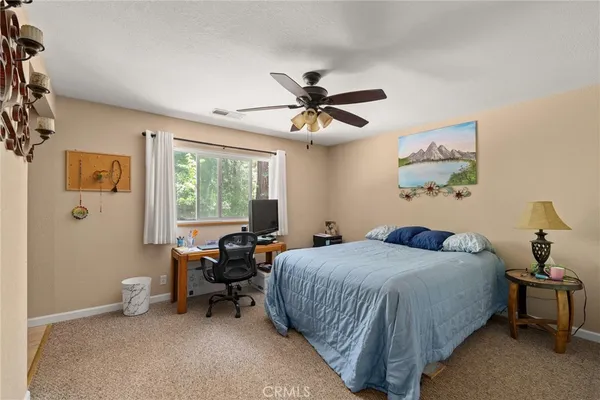 a bedroom with a bed and furniture