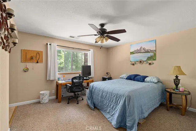 a bedroom with a bed and furniture