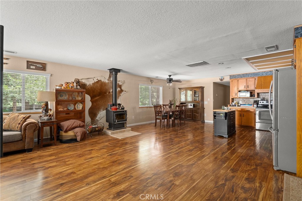6176 Some Way Magalia, CA 95954 - Photo 6 of 46 a living room with furniture and a wooden floor