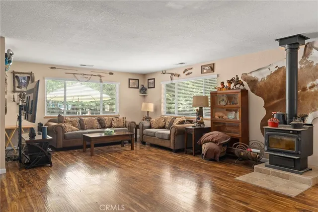 a view of a a dining room with furniture window and wooden floor