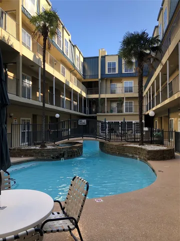 a view of a building with a yard