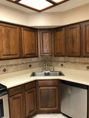a kitchen with a sink and cabinets