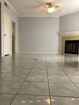 a view of an empty room with a fireplace