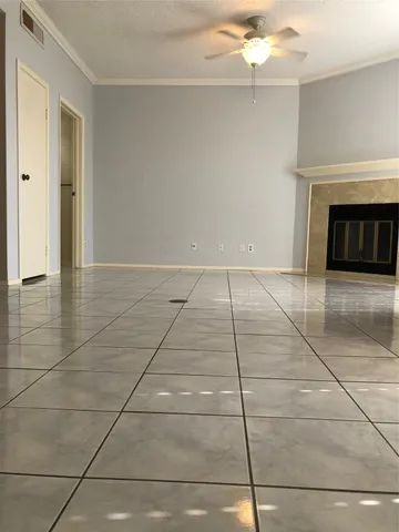 a view of an empty room with a fireplace