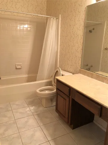 a bathroom with a sink a toilet and a bathtub