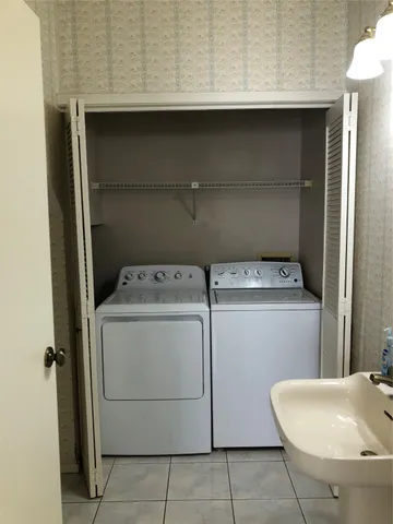 a utility room with dryer and washer