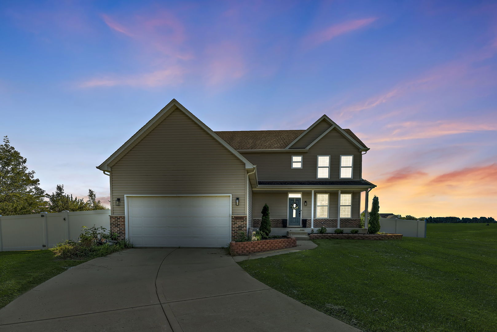 2002 Sandstone Trail Kankakee, IL 60901 - Photo 1 of 27 a front view of a house with a yard