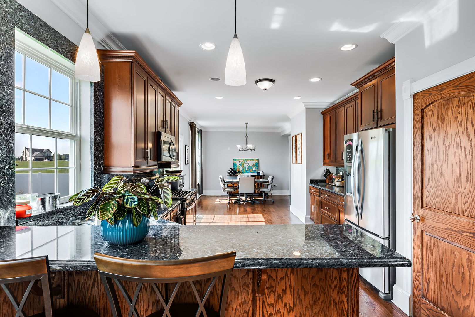 2002 Sandstone Trail Kankakee, IL 60901 - Photo 13 of 27 a kitchen with stainless steel appliances granite countertop sink stove top oven and cabinets